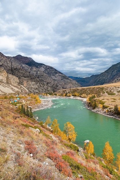 Scenic views of Turquoise Katun river and Altai mountains in autumn