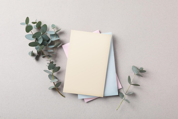 Scented sachets and eucalyptus branches on grey table flat lay