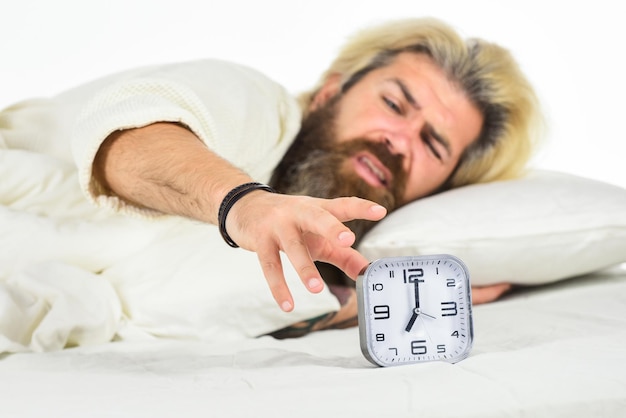 Schedule Getting to bed on time Get up right now Stressed man alarm clock Hate early morning awakening Sleepy guy and alarm clock in bed Bearded man with alarm clock Hipster want to sleep