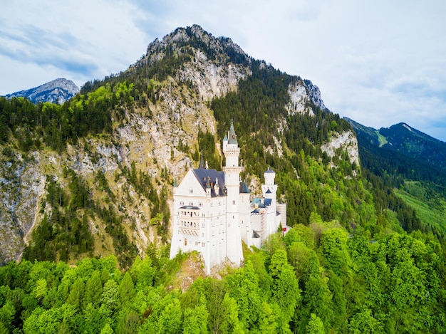 Schloss Neuschwanstein or New Swanstone Castle aerial panoramic view. Neuschwanstein Castle is a Romanesque Revival palace in Hohenschwangau village near Fussen in Bavaria, Germany.