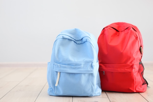 School backpack and stationery in a bright room