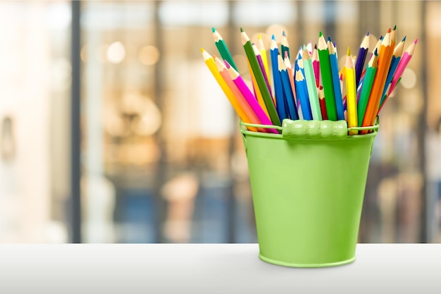 School Backpack with stationery on wooden table