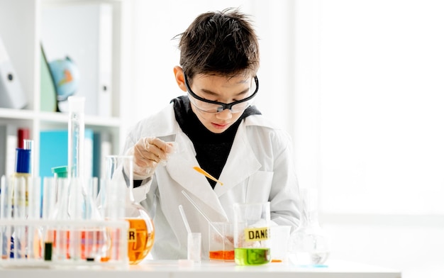 School boy in chemistry class