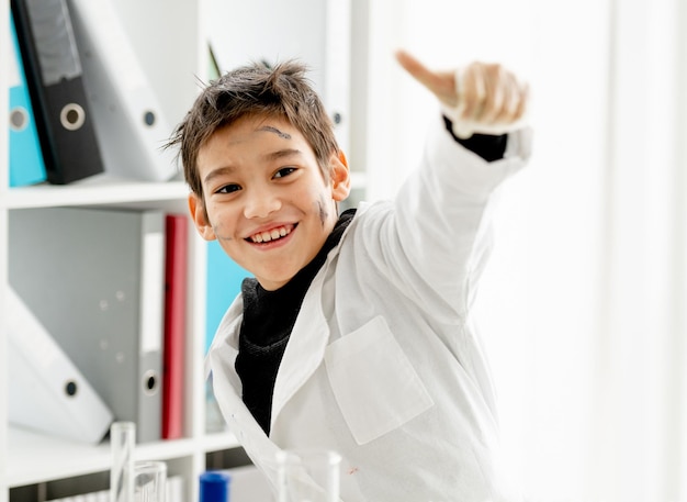 School boy in chemistry class