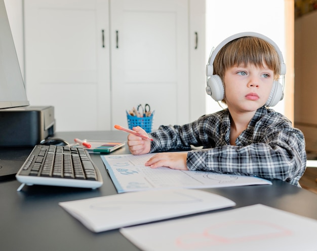 School boy taking online courses