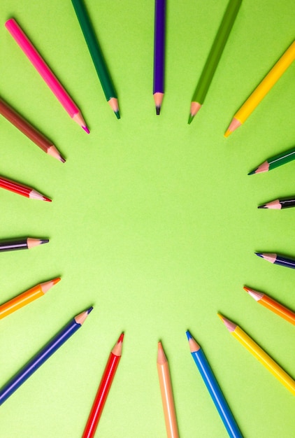 School creative concept. School supplies on green background. Copy space.