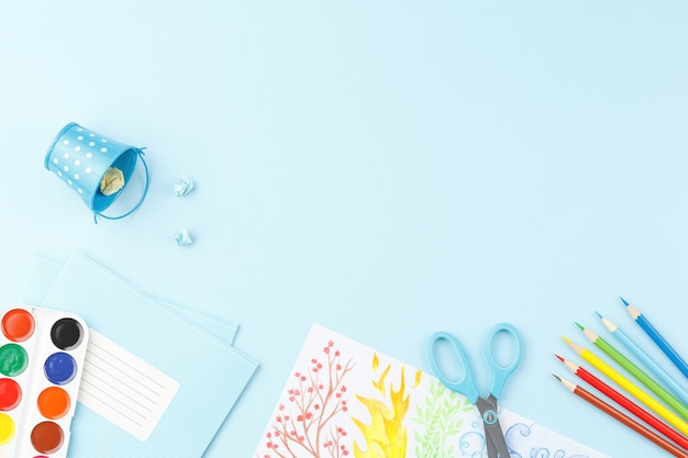 School desk with educational supplies for drawing