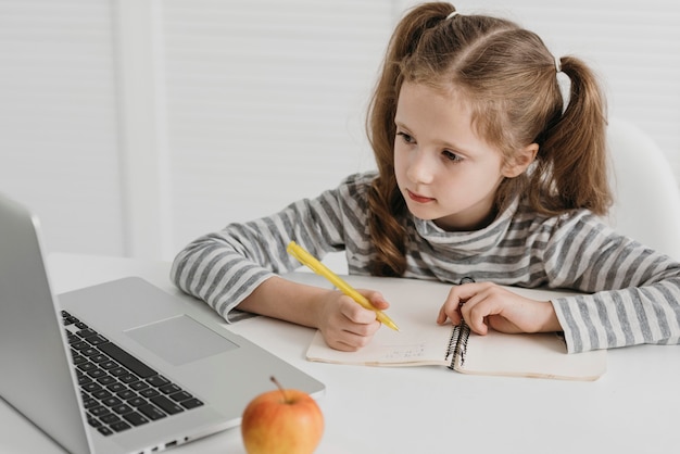 School girl attending online classes