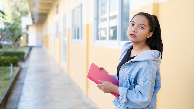 School girl standing at school,young girl.