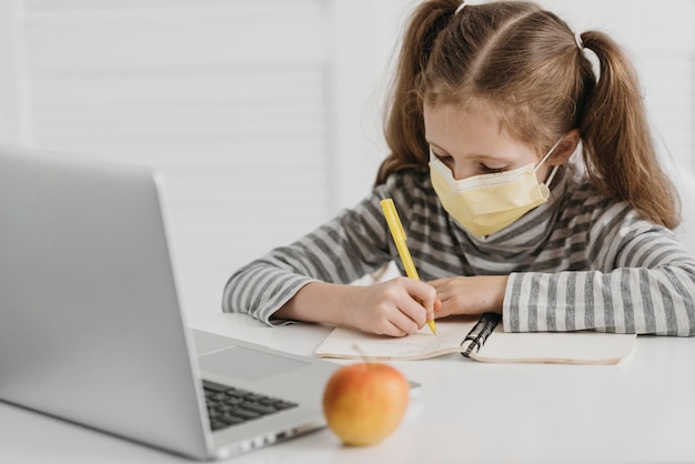 School girl wearing medical mask