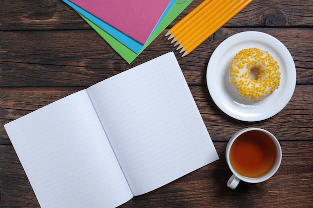 School notebooks tea and donut