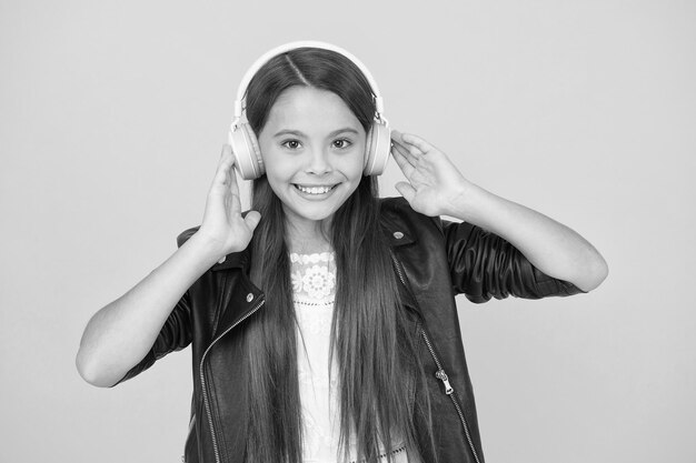 School radio dj lady DJ long hair happy smile hipster urban style girl lifestyle concept biker kid in headset small girl in leather jacket autumn fashion style child listen rock music