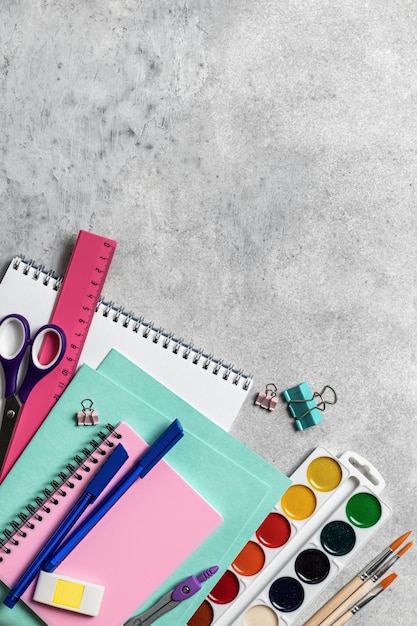 School stationery on gray background Back to school concept with text space