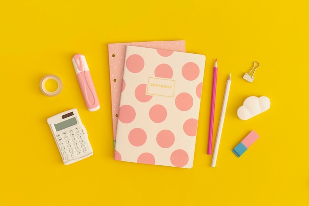 School stationery on a yellow background Top view with copy space Flat lay Back to school concept