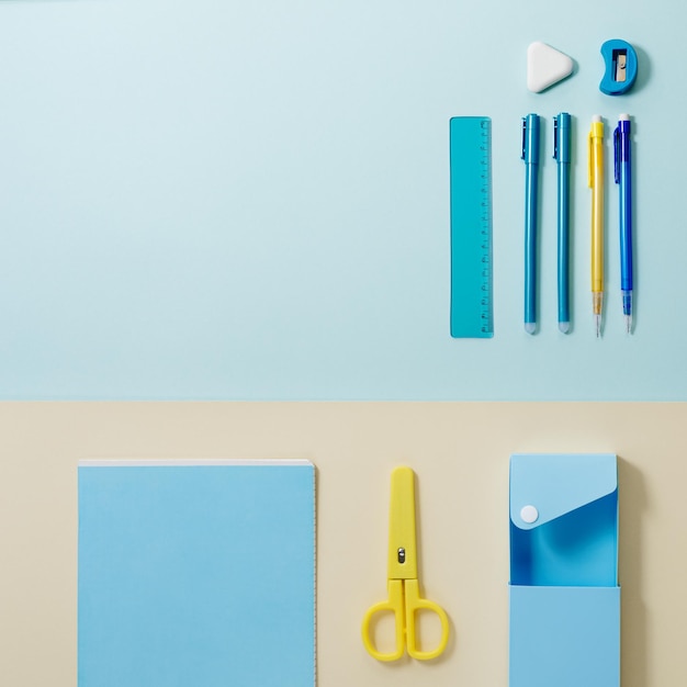 School stationery in yellow and blue tone Office accessories study and educational flat lay