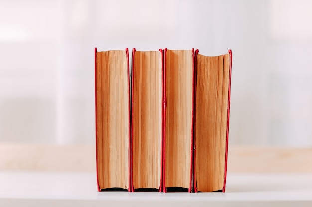 School supplies. Big red books on the table.