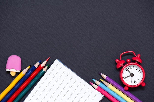 School supplies on a black background. back to school