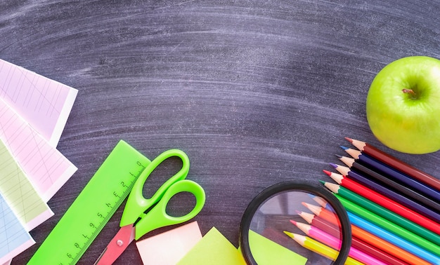 School supplies on a blackboard