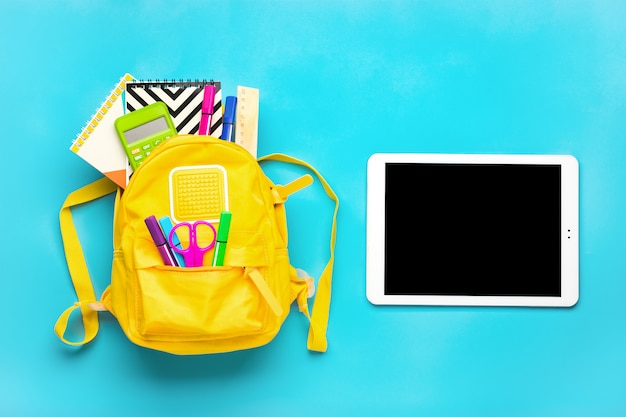 School supplies on a blue background