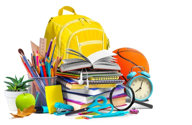 School supplies books and backpack composition isolated on white background