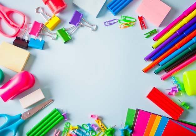 School supplies frame on the light background.