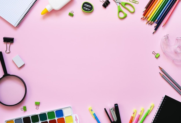 School supplies on a paper pink background Back to school