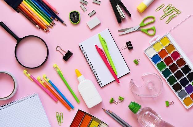 School supplies on a paper pink background Back to school