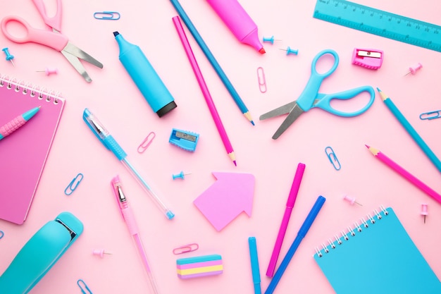 School supplies on pink background. Back to school. Flat lay. Minimalism