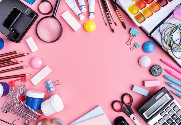 School supplies on pink top view, flat lay