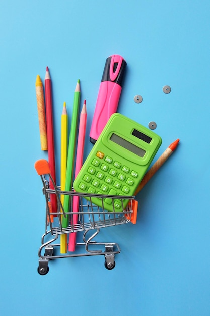 School supplies in the shopping cart, buying school supplies