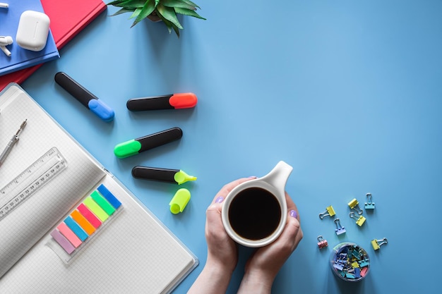 School supplies stationery on a blue background copy space