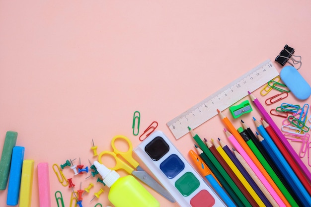 School supplies and stationery pink backgroundPreparing child for school