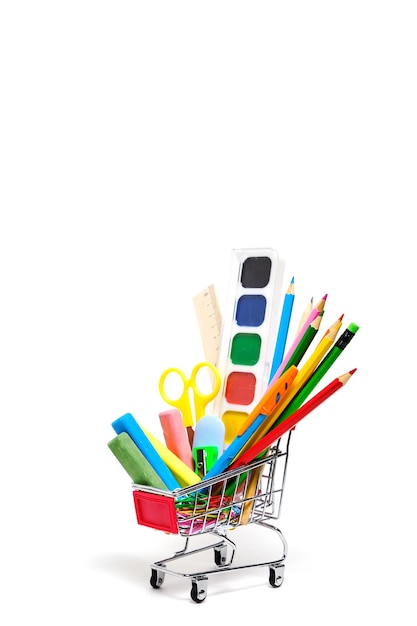 School supplies and stationery in a shopping basket white backgroundPreparing child for school year