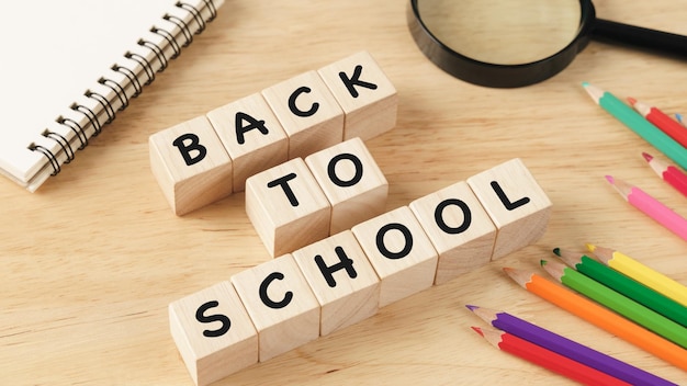 School supplies on wooden table background Back to school conceptxA