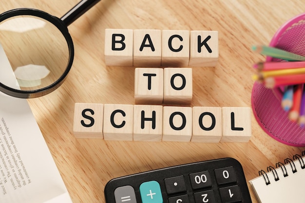 School supplies on wooden table background Back to school conceptxA