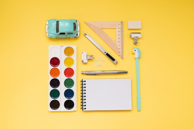  School supplies on yellow background