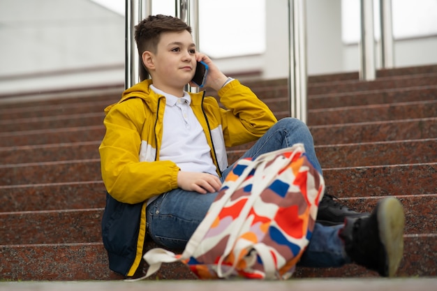 Schoolboy talking on the phone