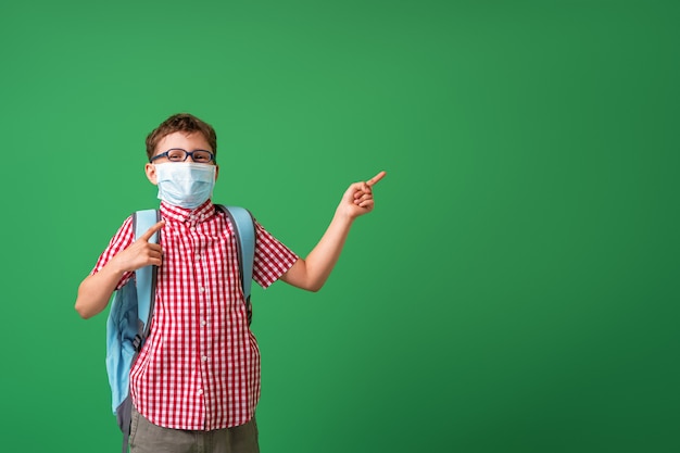 Schoolboy wearing a protective mask