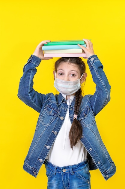 The schoolgirl with backpack wearing casual jeans denim shirt outfit