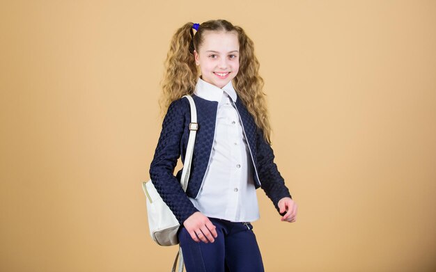 Schoolgirl with small leather backpack Carry bag comfortable Stylish mini backpack Learn how fit backpack correctly Girl little fashionable cutie carry backpack Popular useful fashion accessory