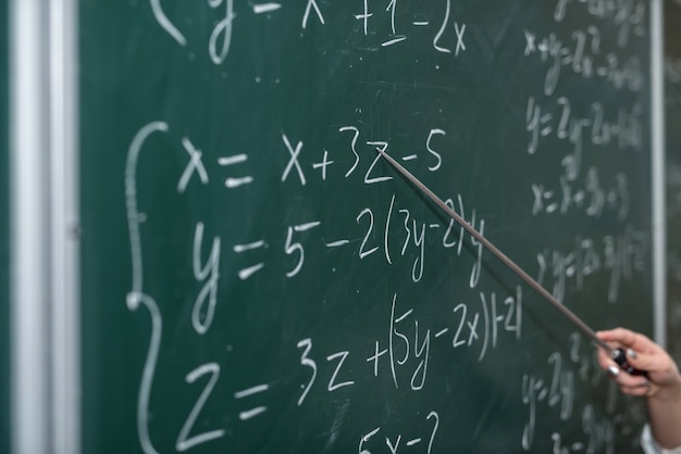 Schooling. Mathematical formulas are written on the blackboard