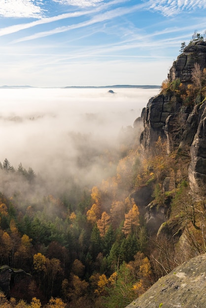 Schrammstein mountains Autumn landscape Fog Blue sky Saxon Switzerland Germany