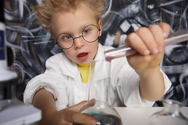 Science buff carefully pours substances from small test tube into large flask