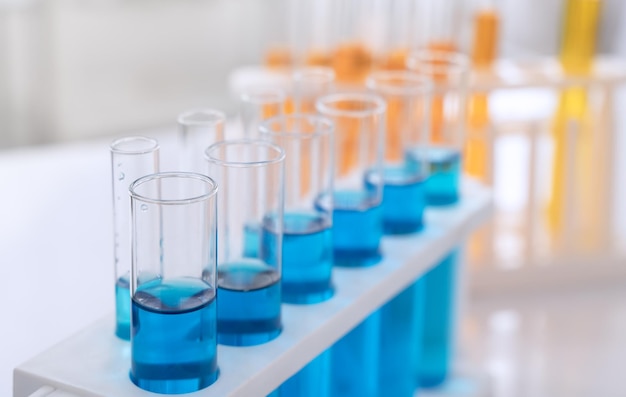 Science laboratory test tubes with blue and orange chemical liquid