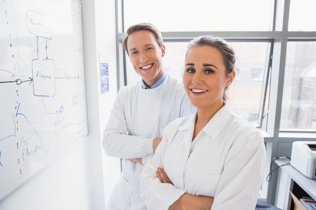 Science student and lecturer smiling at camera