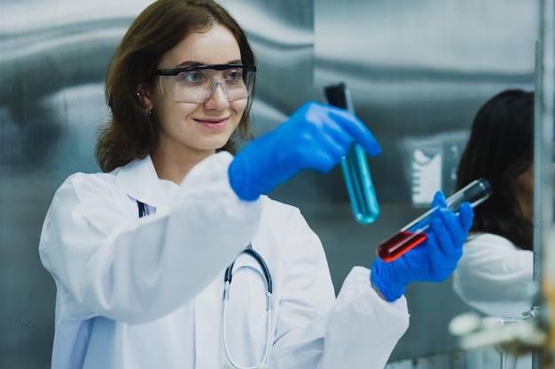 science technology chemist developing concept female researcher medical scientist or doctor or student is looking in a microscope in Modern Laboratory