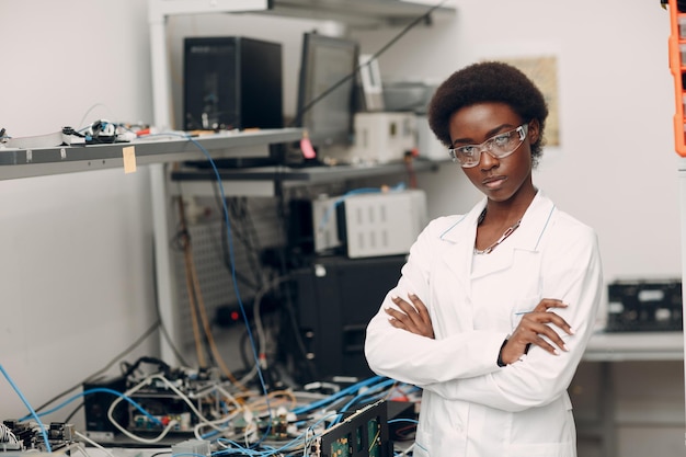 Scientist african american woman working in laboratory with electronic instruments