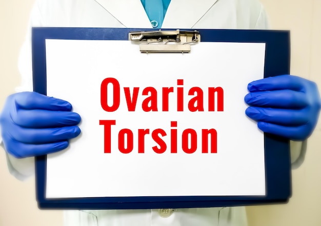 Scientist or Doctor holding clipboard with medical term Ovarian Torsion , health and medical concept