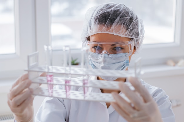 Scientist holding laboratory test tube