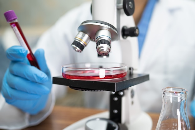 Scientist holding of sample of vaccine test